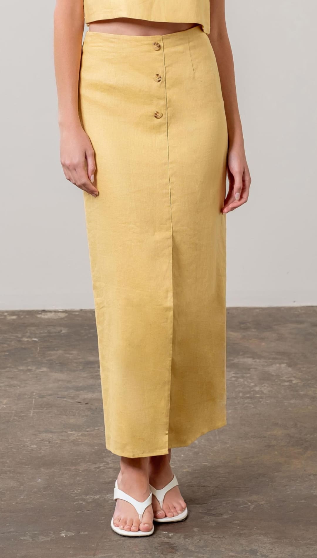 Mustard-colored button-front skirt.