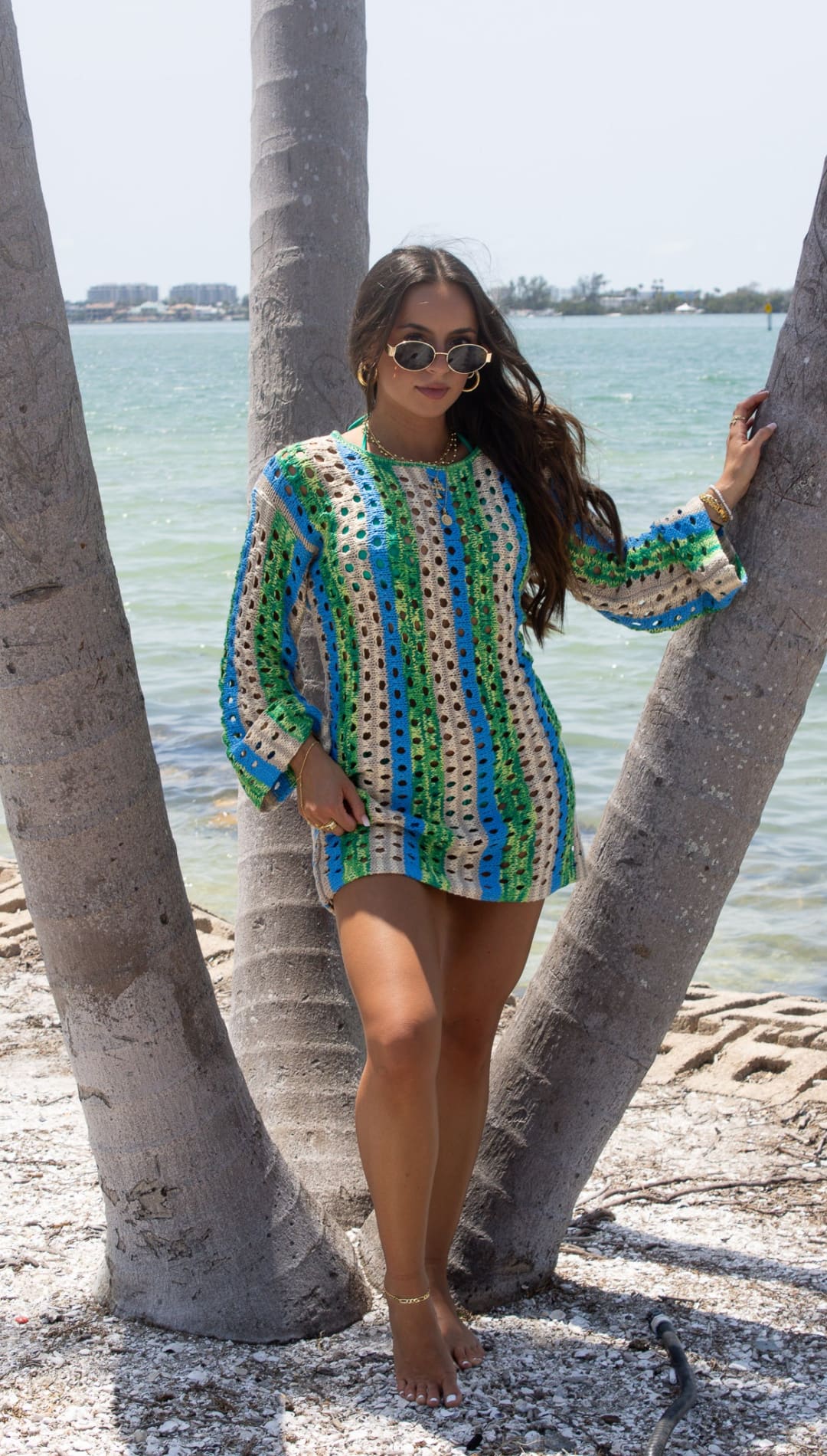 Crocheted mini dress with long sleeves.