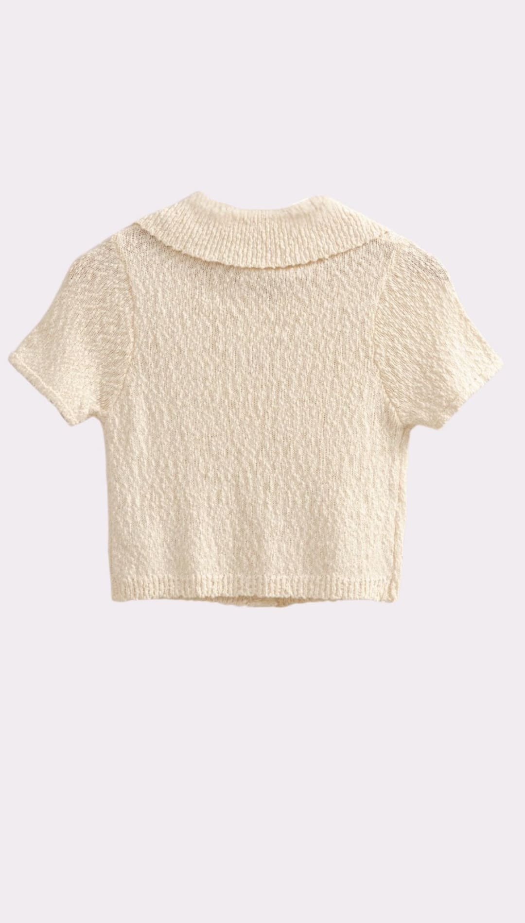 Cream-colored knit polo shirt.