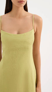 A light green, sleeveless dress with thin straps and a fitted silhouette.