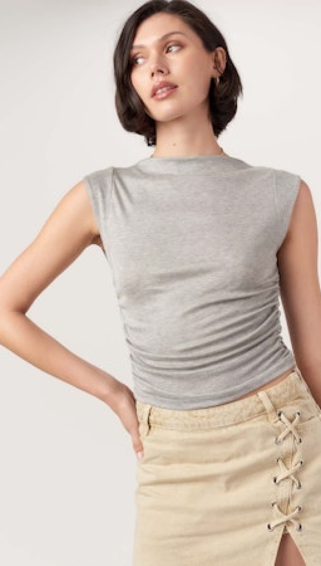 Gray sleeveless top.
