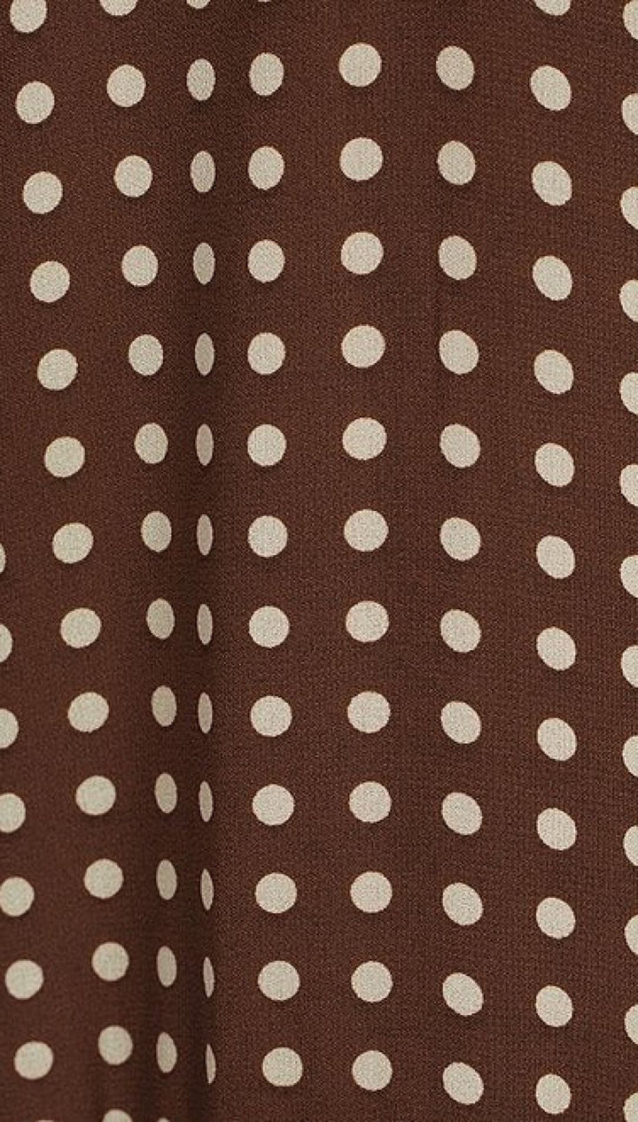 Brown fabric with white polka dots.