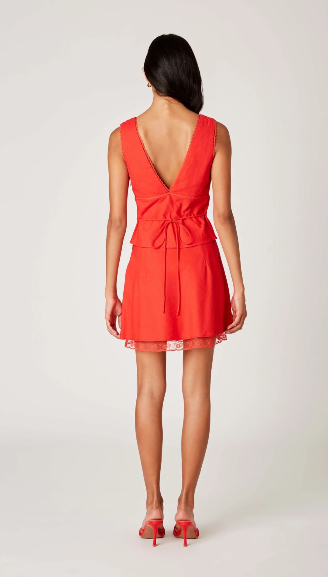 Red sleeveless dress with back tie.