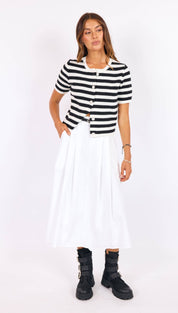 A black and white striped short-sleeved knit cardigan with a button front.