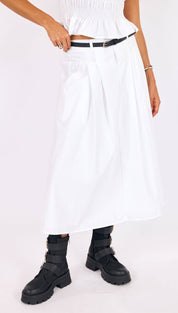 White pleated midi skirt with a smocked waistband and black belt.