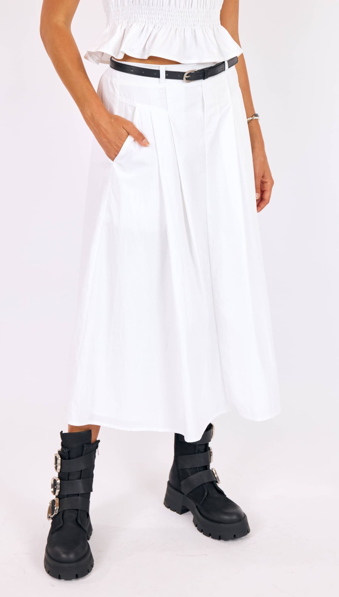 White pleated midi skirt with a high-waisted design and side pockets.