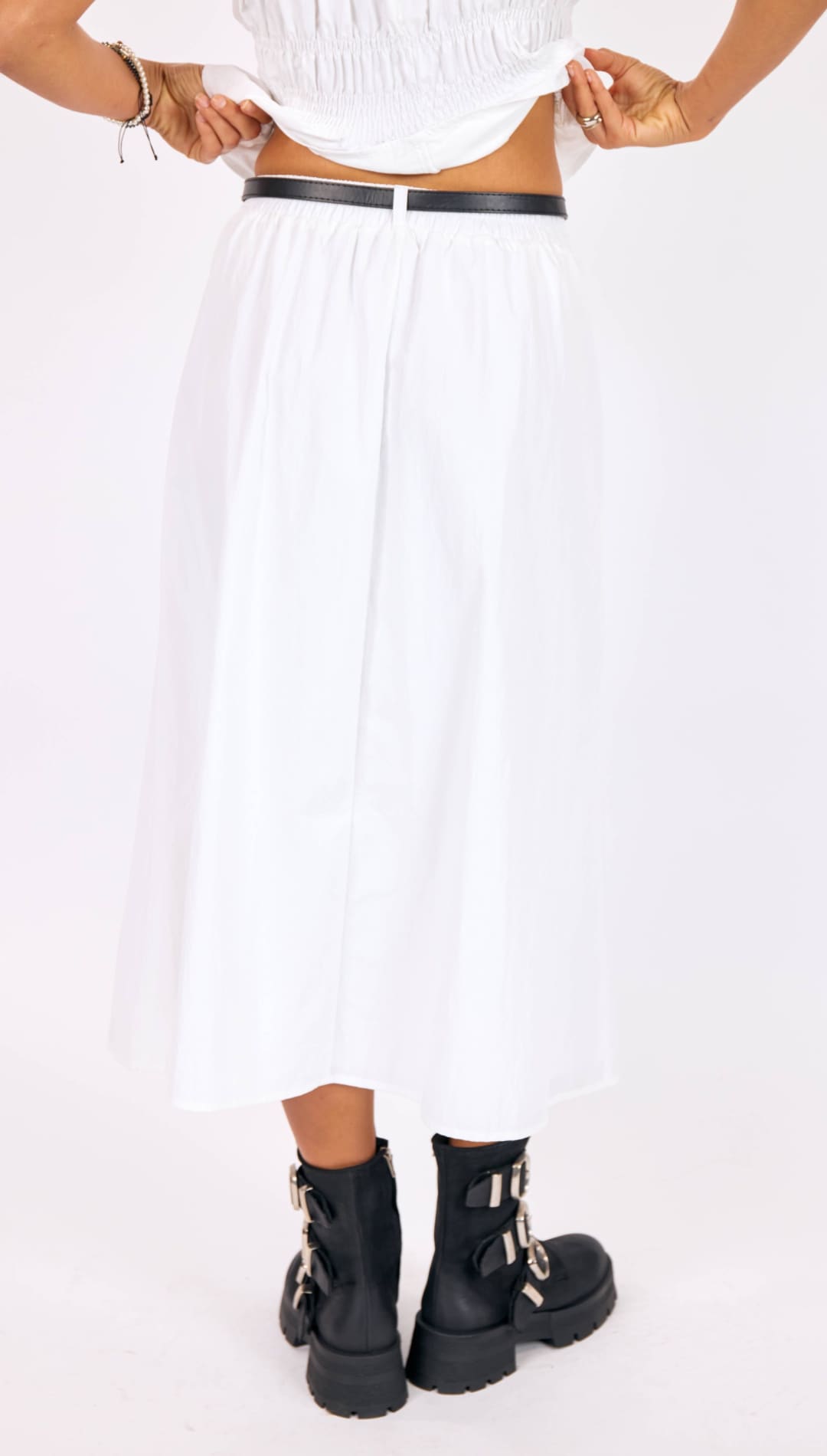 White pleated midi skirt with black belt