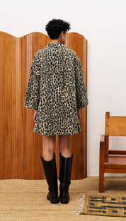 A woman’s leopard print long-sleeved dress.