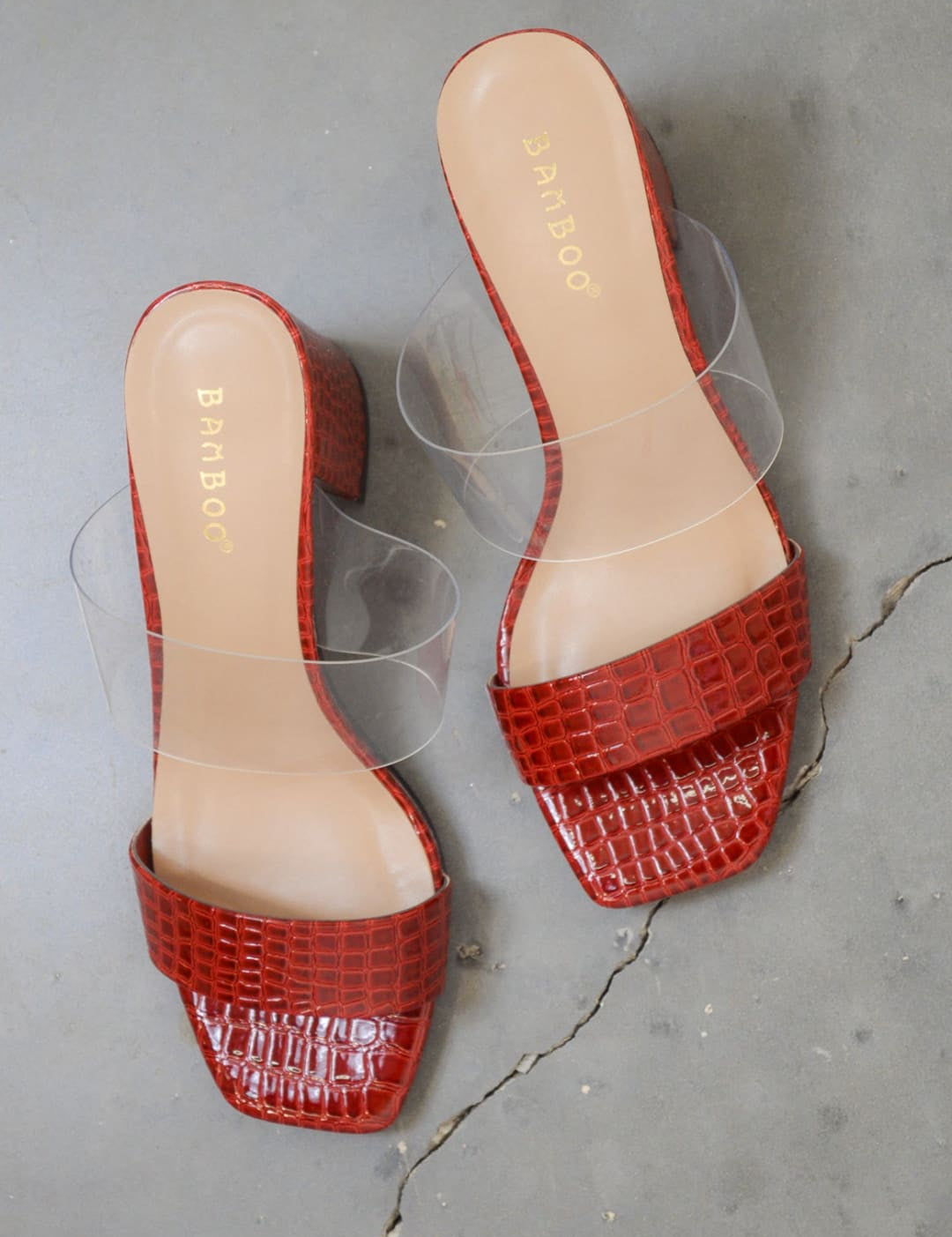 Red faux-crocodile heeled sandals.