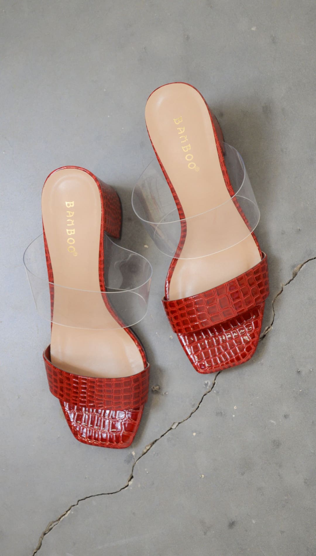 Red faux-crocodile heeled sandals.