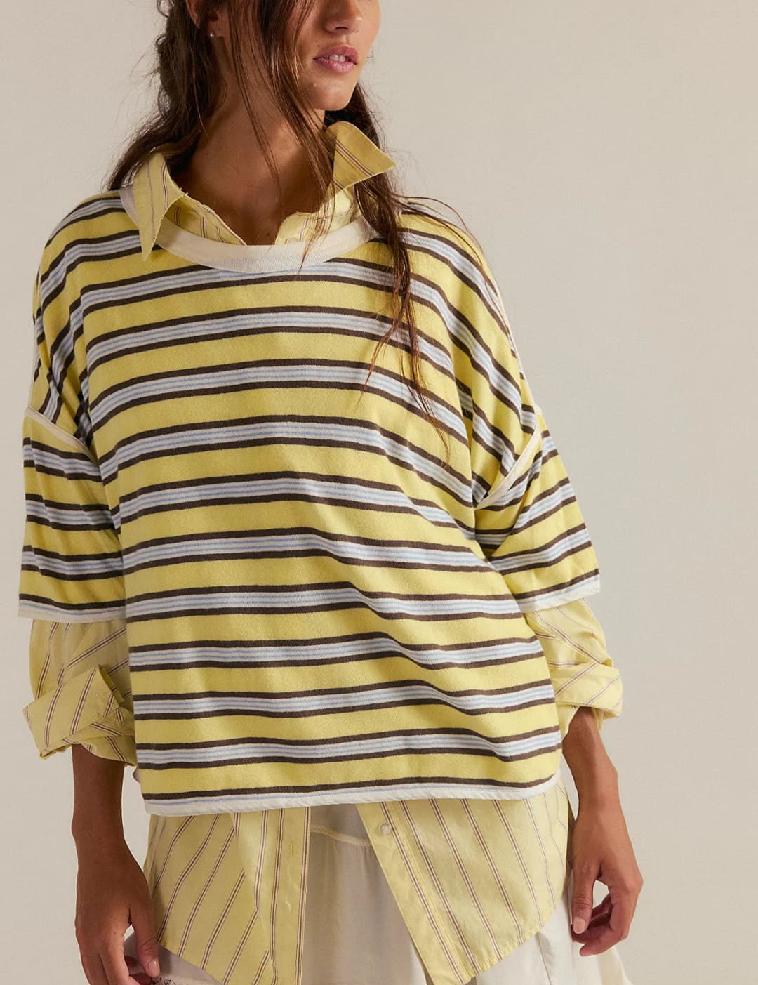 Yellow striped oversized shirt with lace trim and layered design.