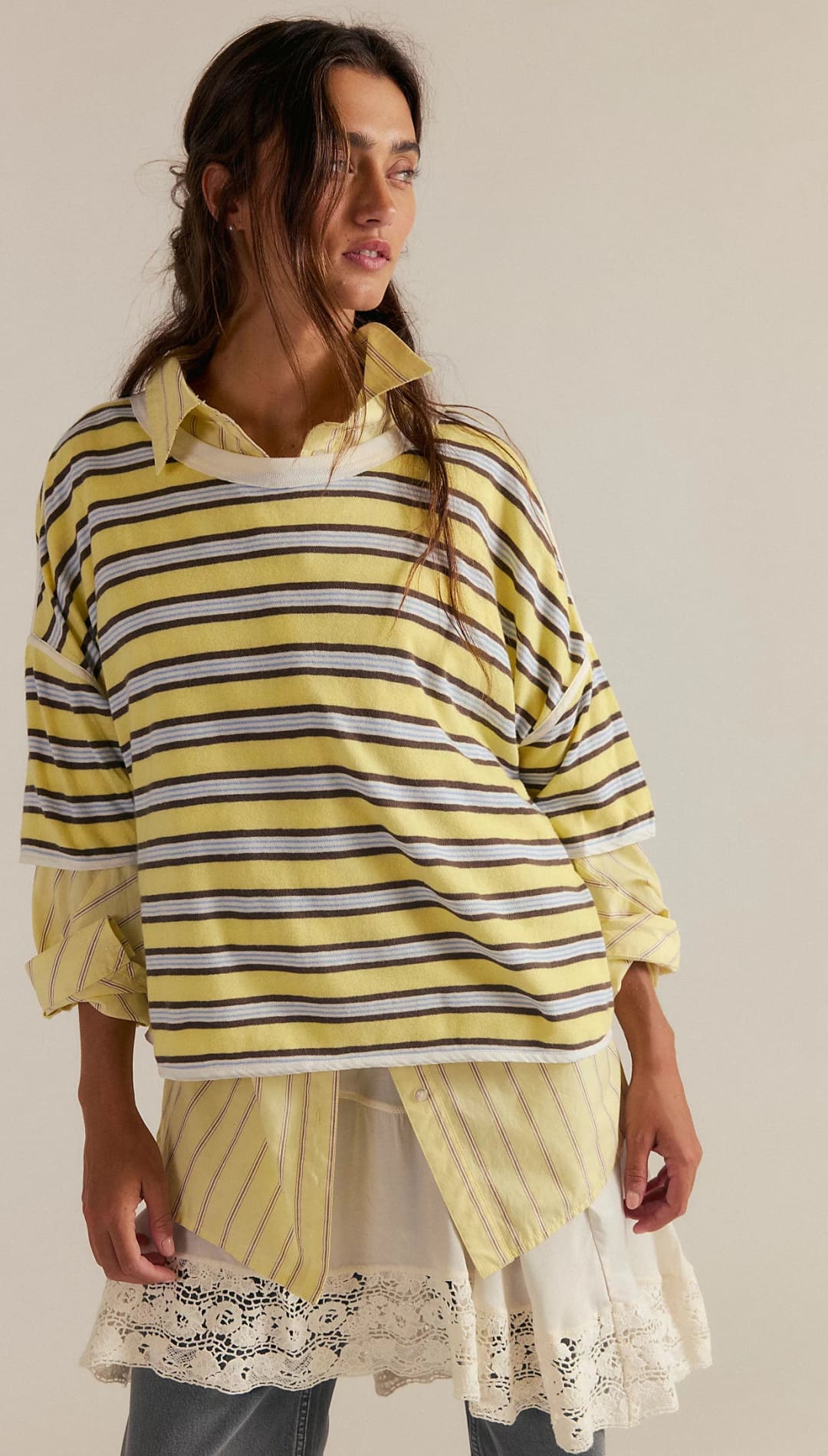 Yellow striped oversized shirt with lace trim and layered design.