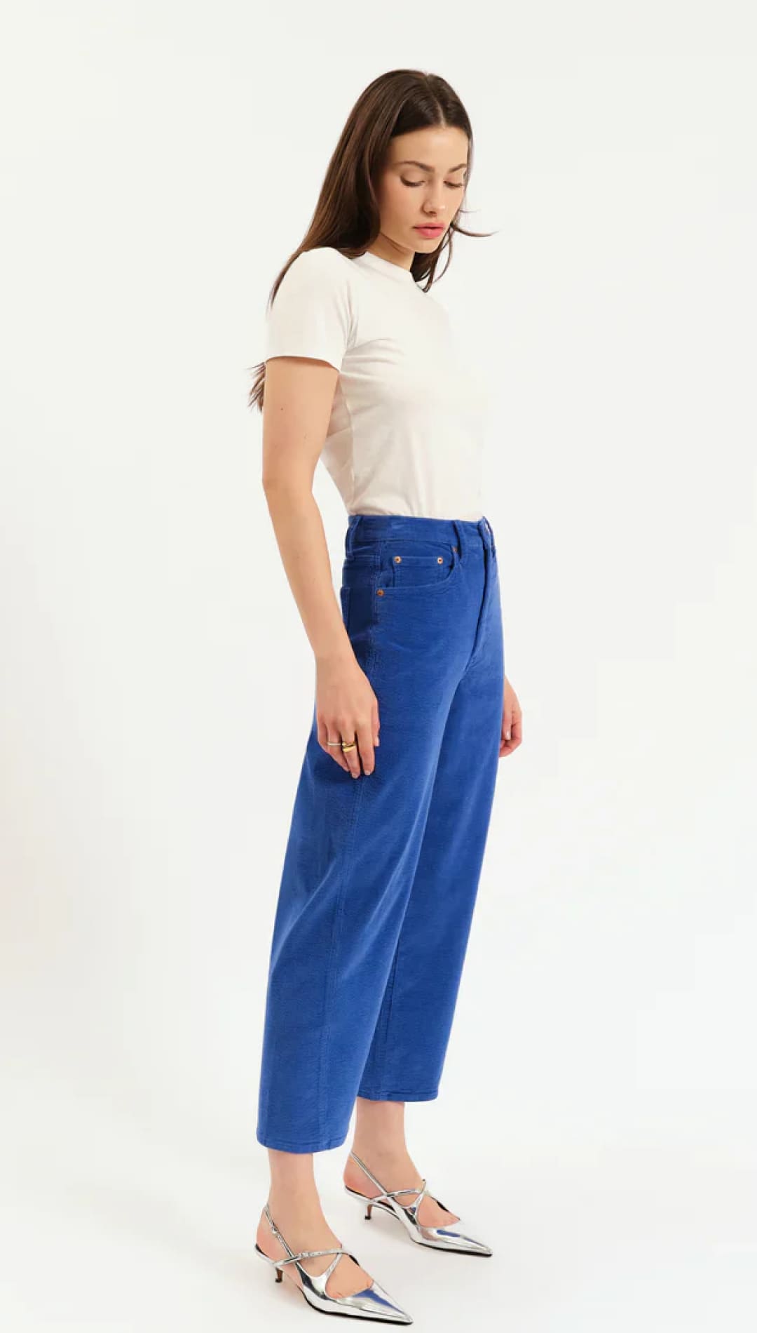Royal blue corduroy cropped pants with silver metallic heels and white t-shirt.