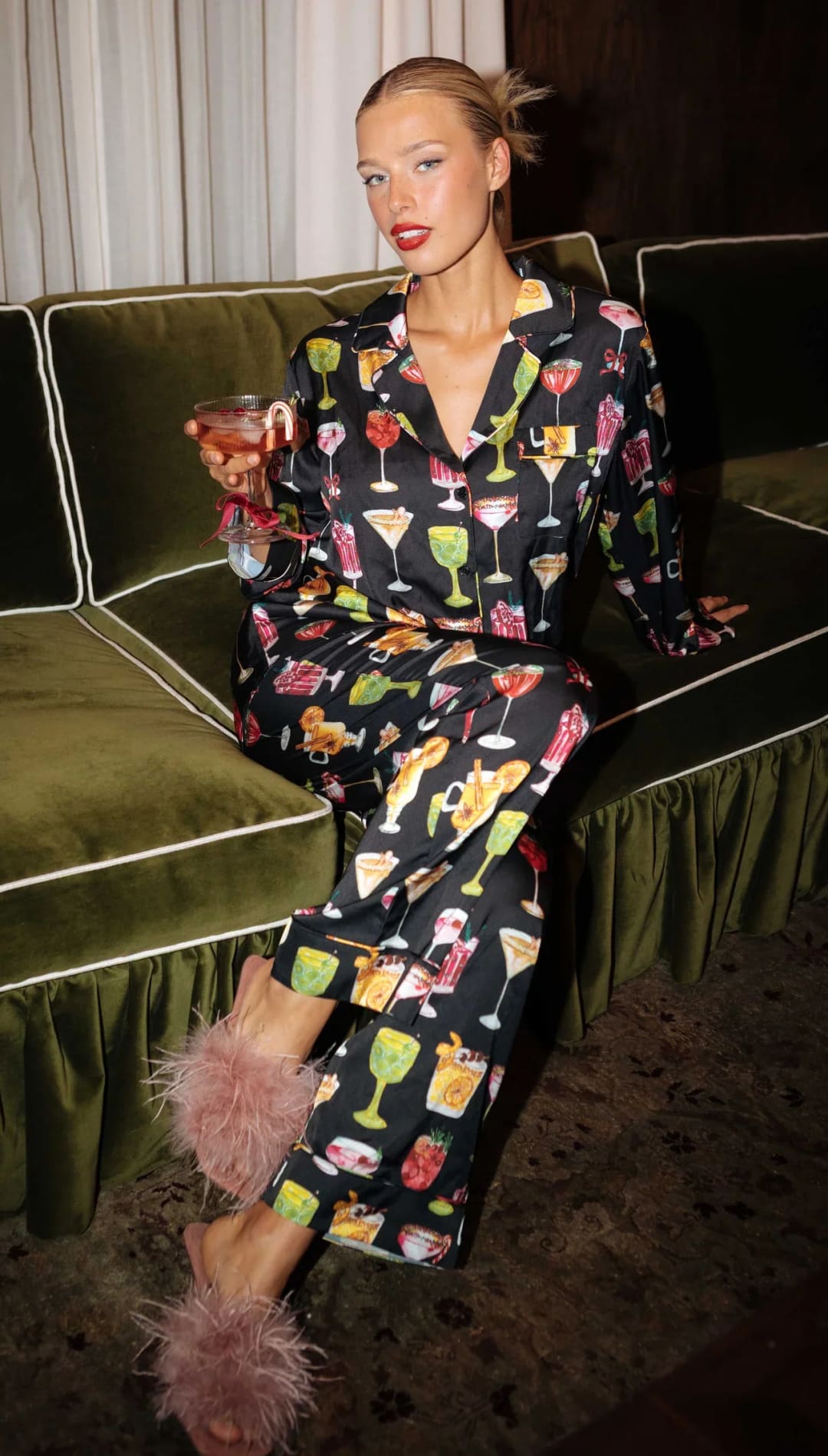 Black cocktail print pajama set with pink fluffy slippers.