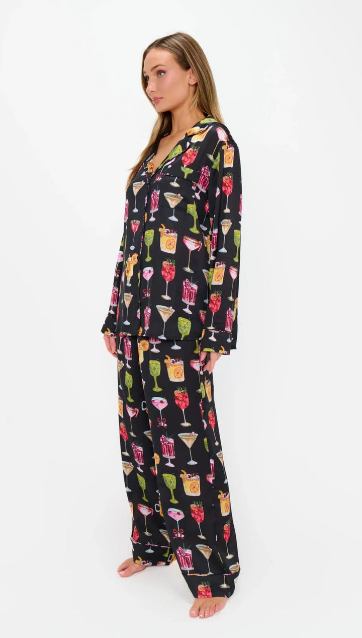 Black cocktail print pajama set with long sleeves and pants, featuring a variety of colorful drinks in different glasses.