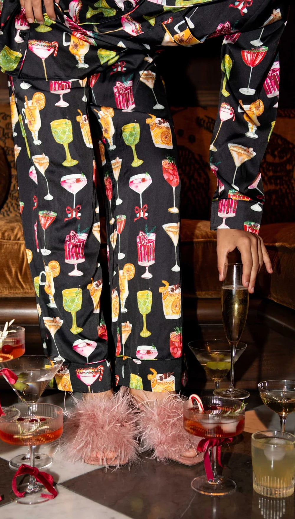 Black cocktail-themed pajama pants with colorful drinks and glasses design, featuring a silky material.