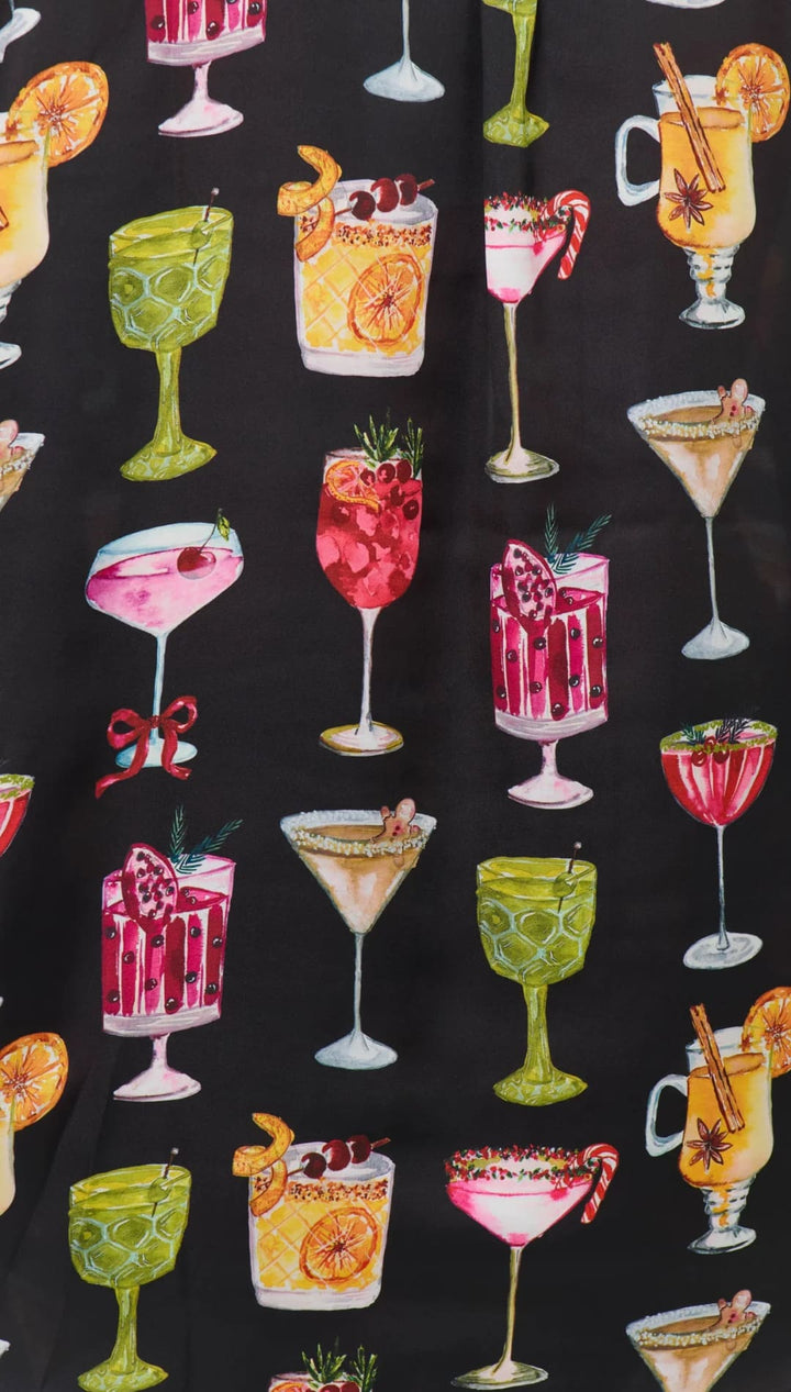 Black cocktail-themed fabric with colorful drinks and glasses design, suitable for a bar or kitchen decor.