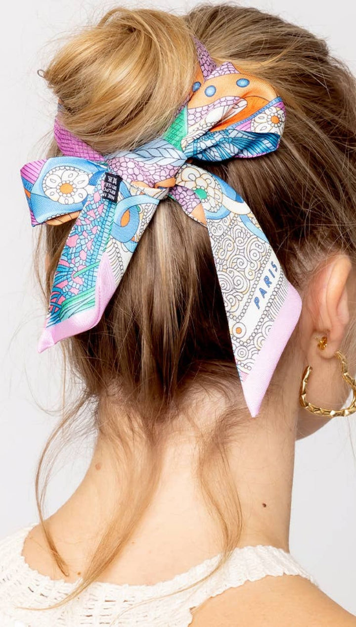 Colorful patterned silk hair scarf.