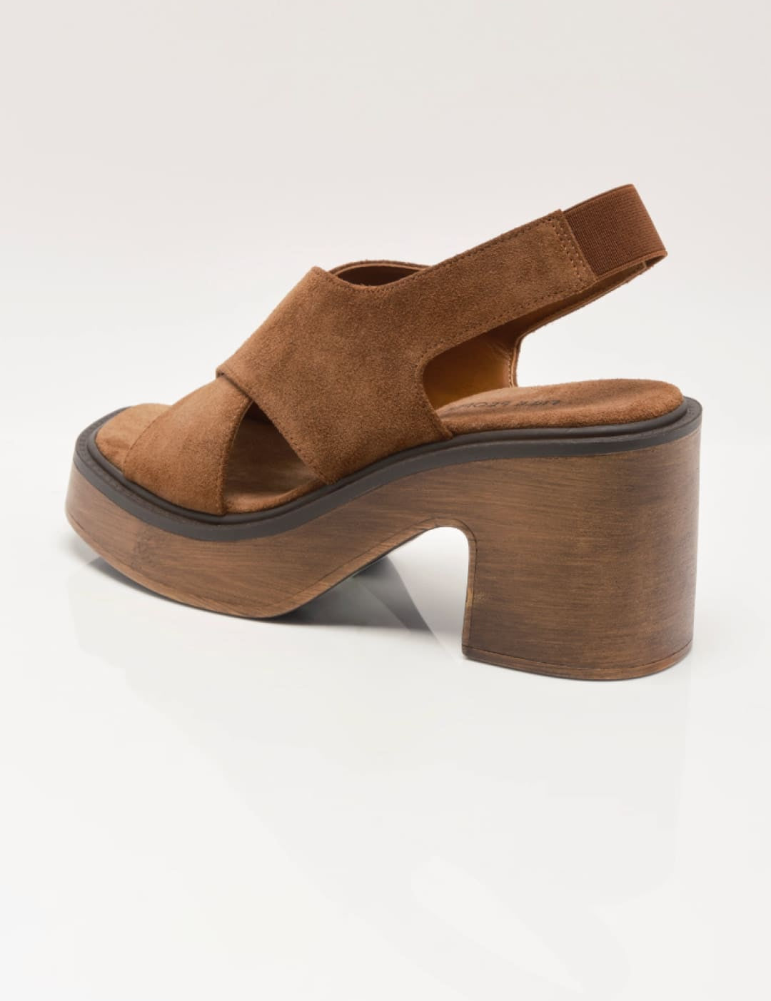 Brown suede platform sandal with a chunky wooden heel and crisscross strap design.