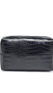 Black crocodile-patterned leather cosmetic bag with gold zipper.