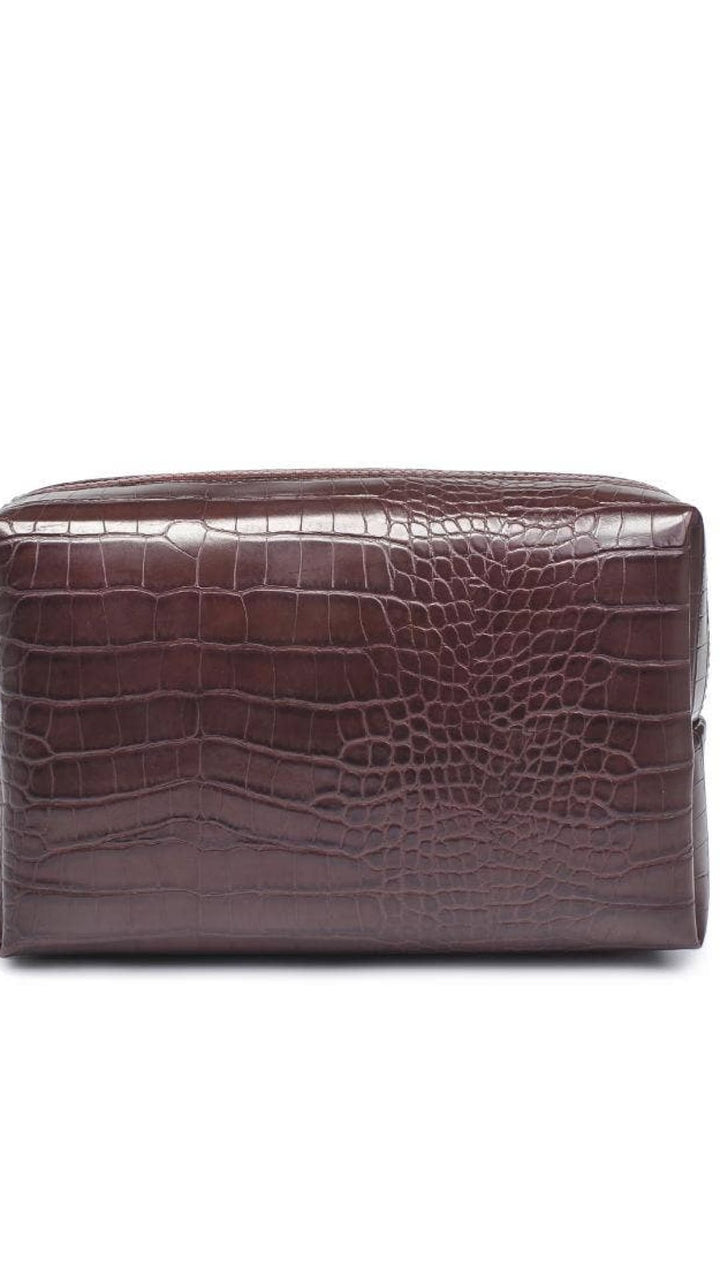Crocodile-patterned brown leather toiletry bag with gold zipper.