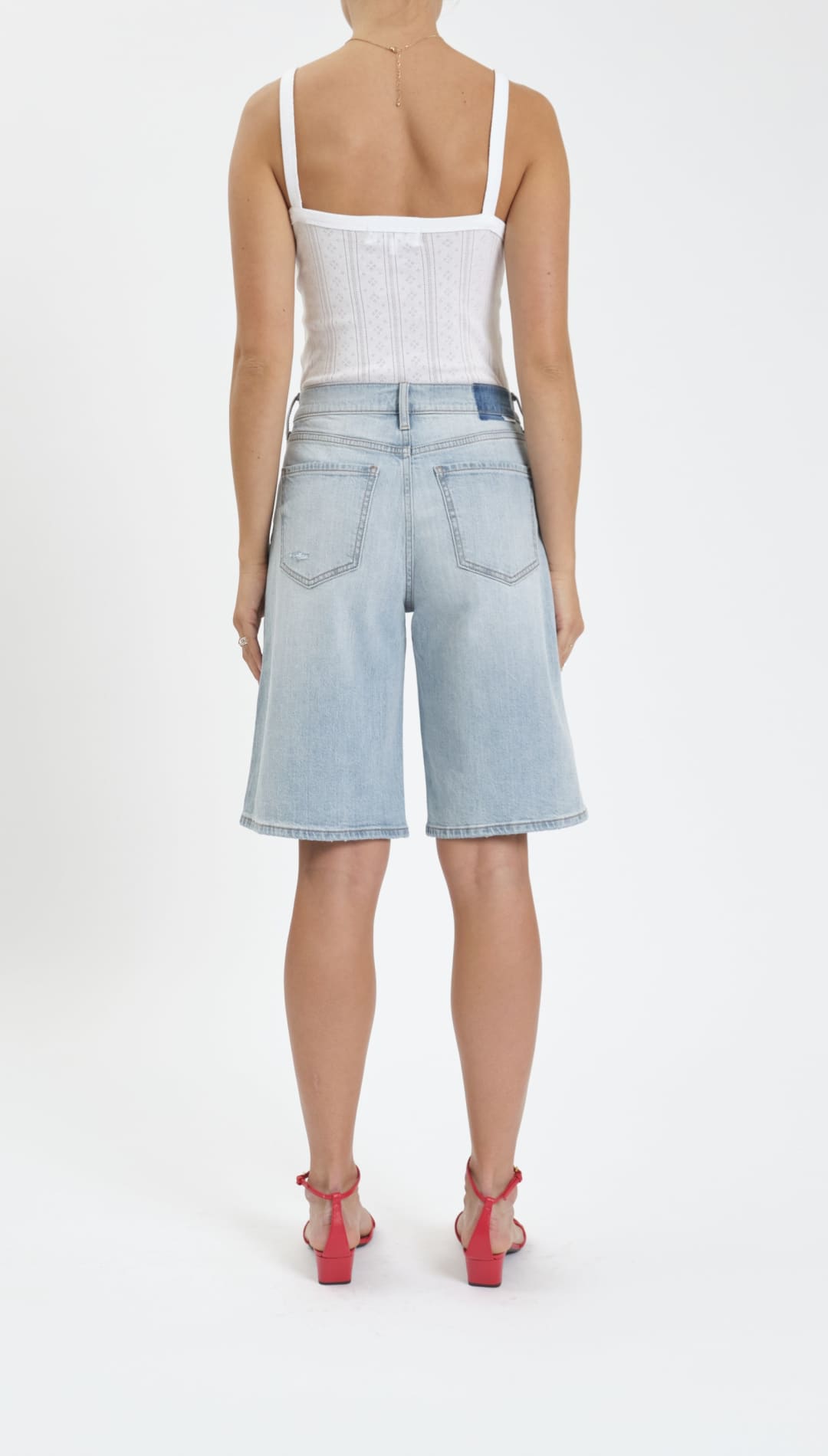 Woman’s light blue denim Bermuda shorts.
