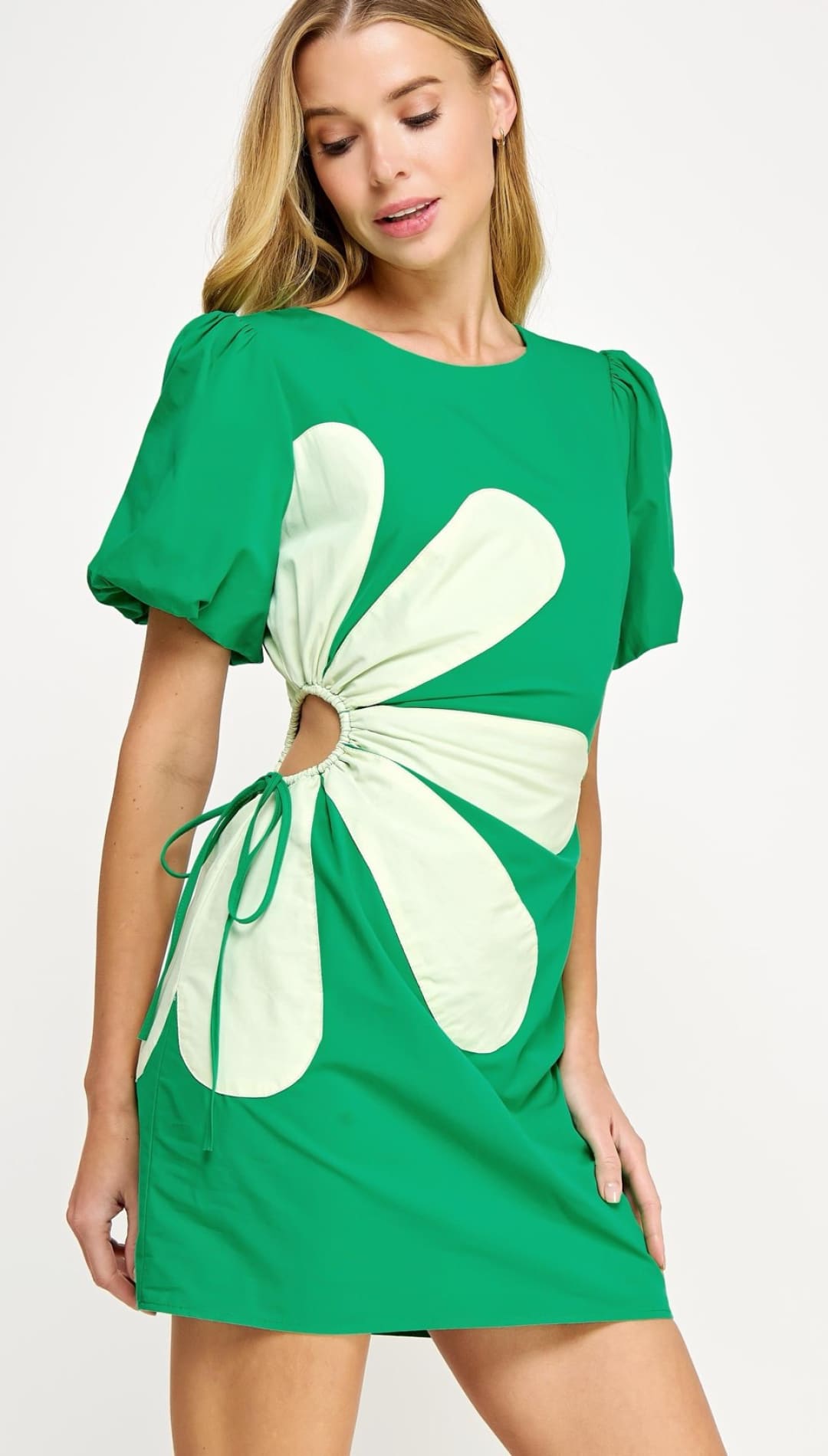 Green dress with flower cutout.