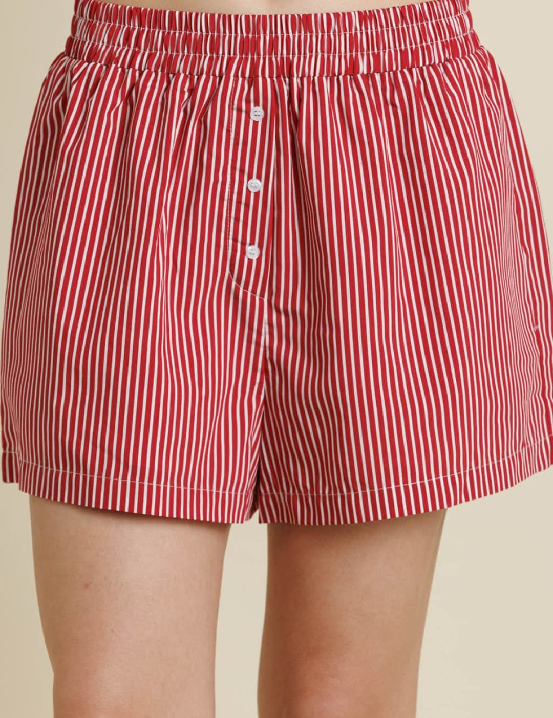 Red and white striped cotton boxer shorts with a button fly.