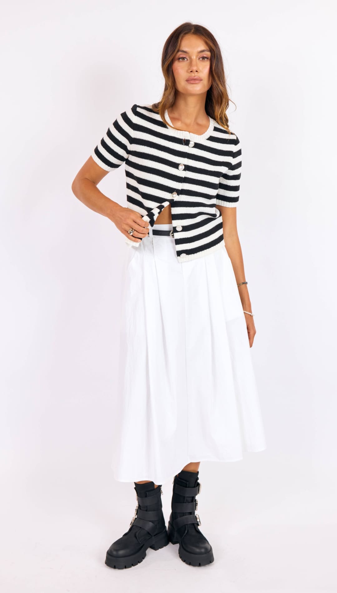 Black and white striped short-sleeved knit top with button front.