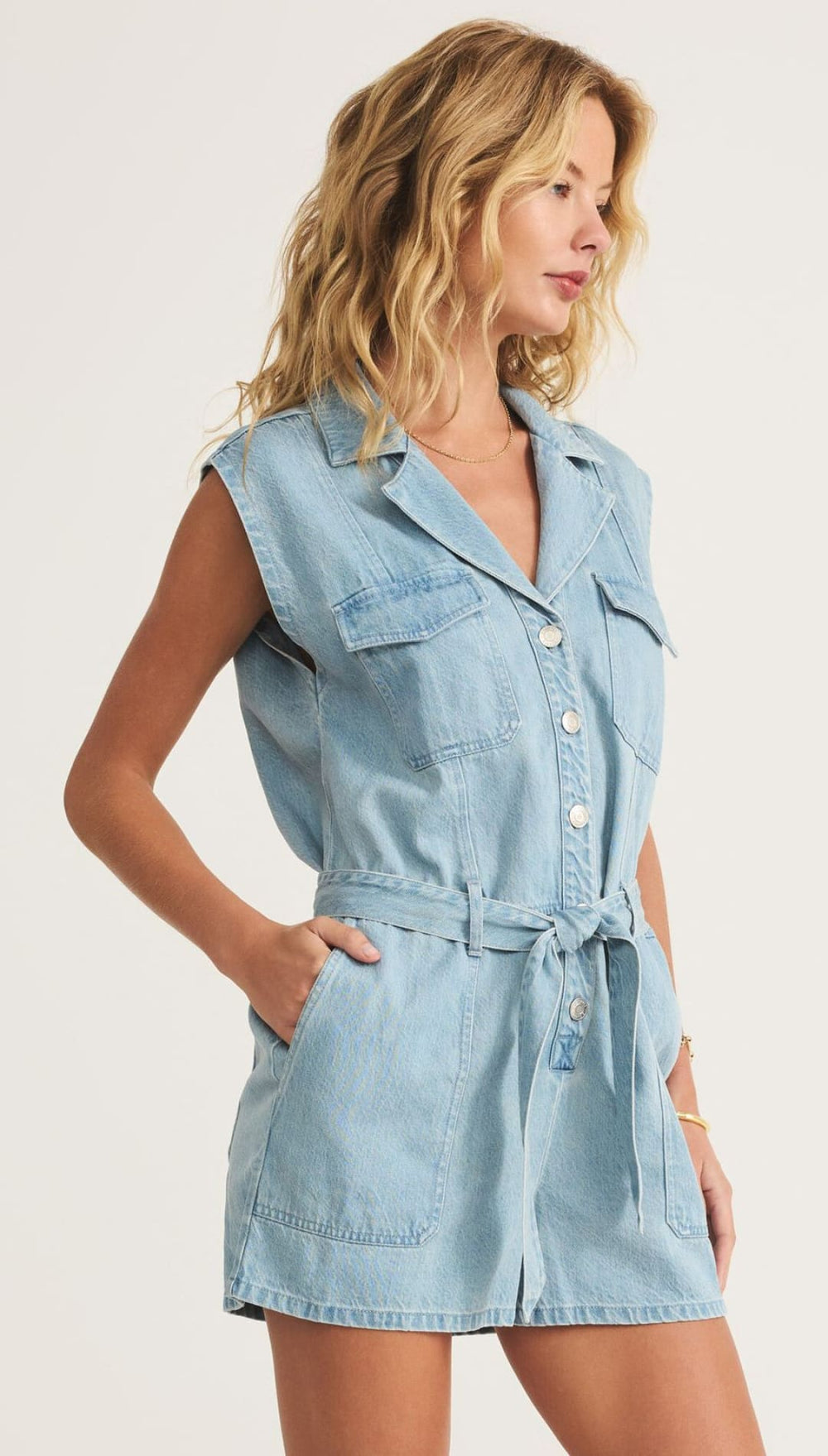 Light blue denim romper.