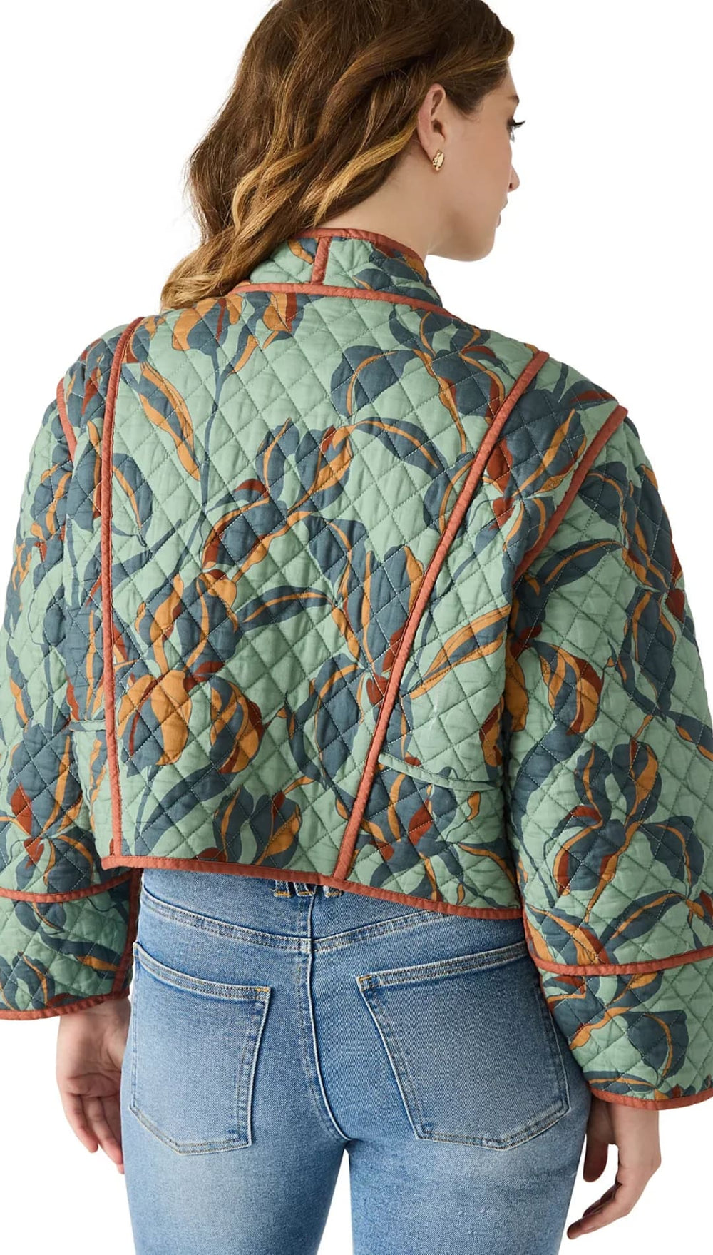 Quilted jacket with a green, blue, and orange leaf pattern.