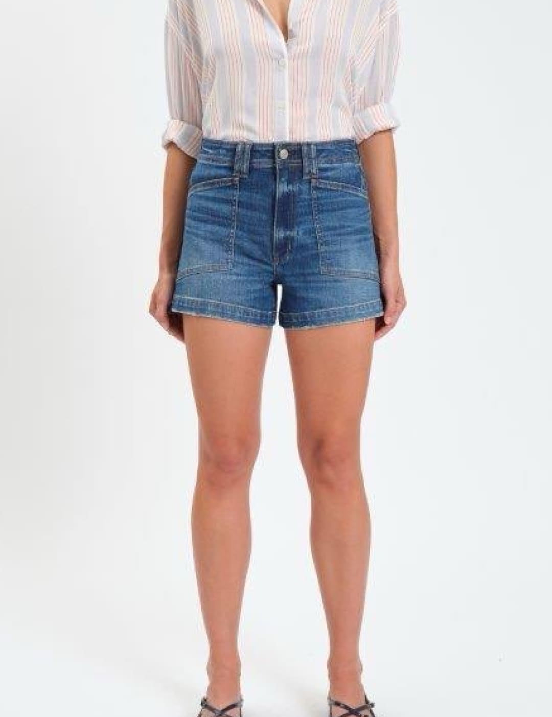 High-waisted blue denim shorts with a classic five-pocket design and rolled-up sleeves on the matching striped shirt.