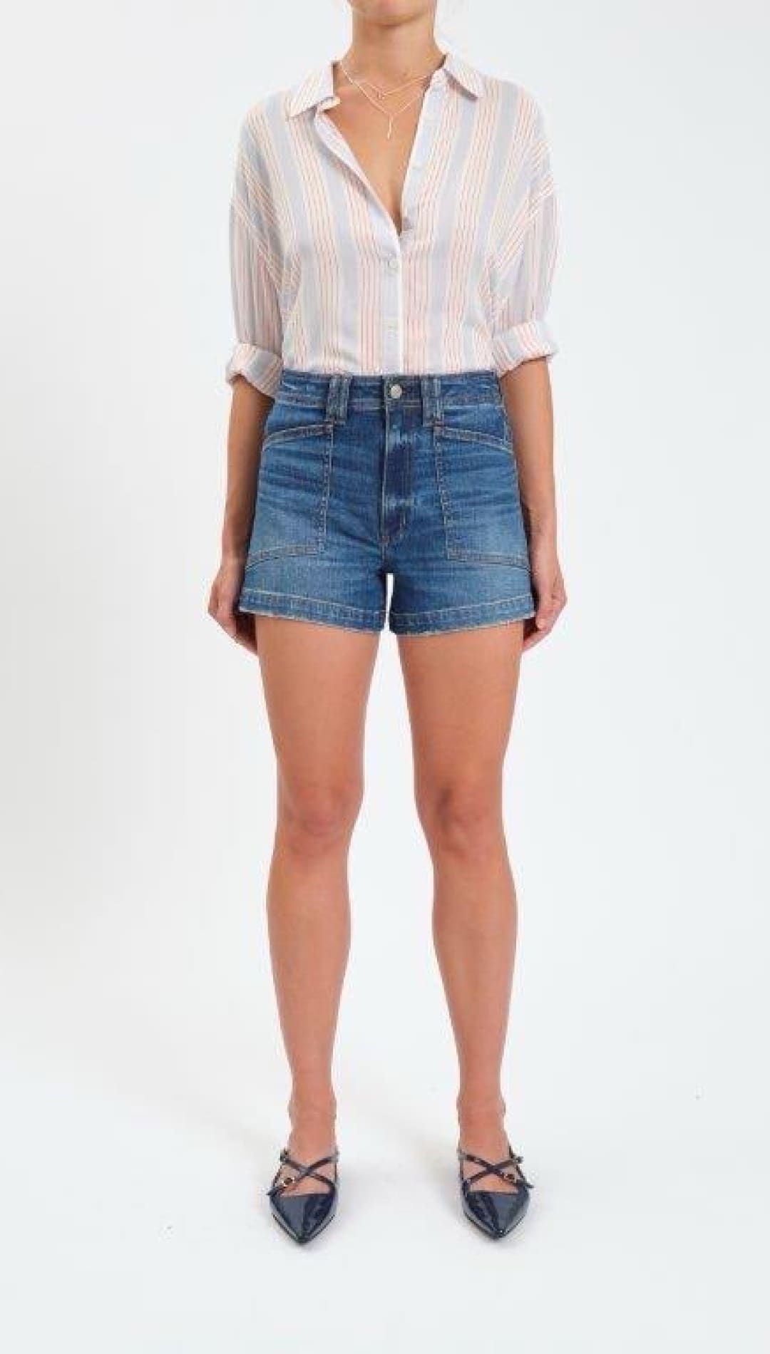 High-waisted blue denim shorts with a classic five-pocket design and rolled-up sleeves on the matching striped shirt.