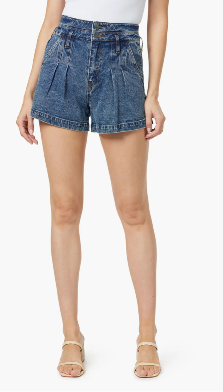 Blue denim pleated shorts.