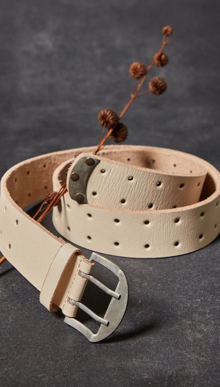 Beige leather belt with double row of holes.