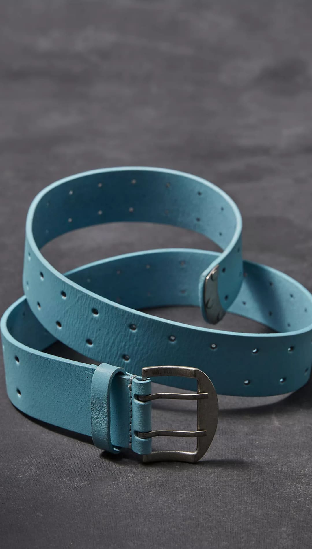 Light blue leather belt with silver buckle.