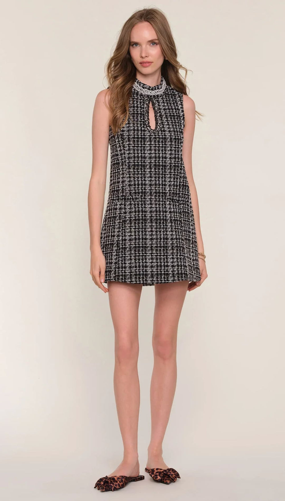 Tweed mini dress with keyhole neckline and floral print, black and white.