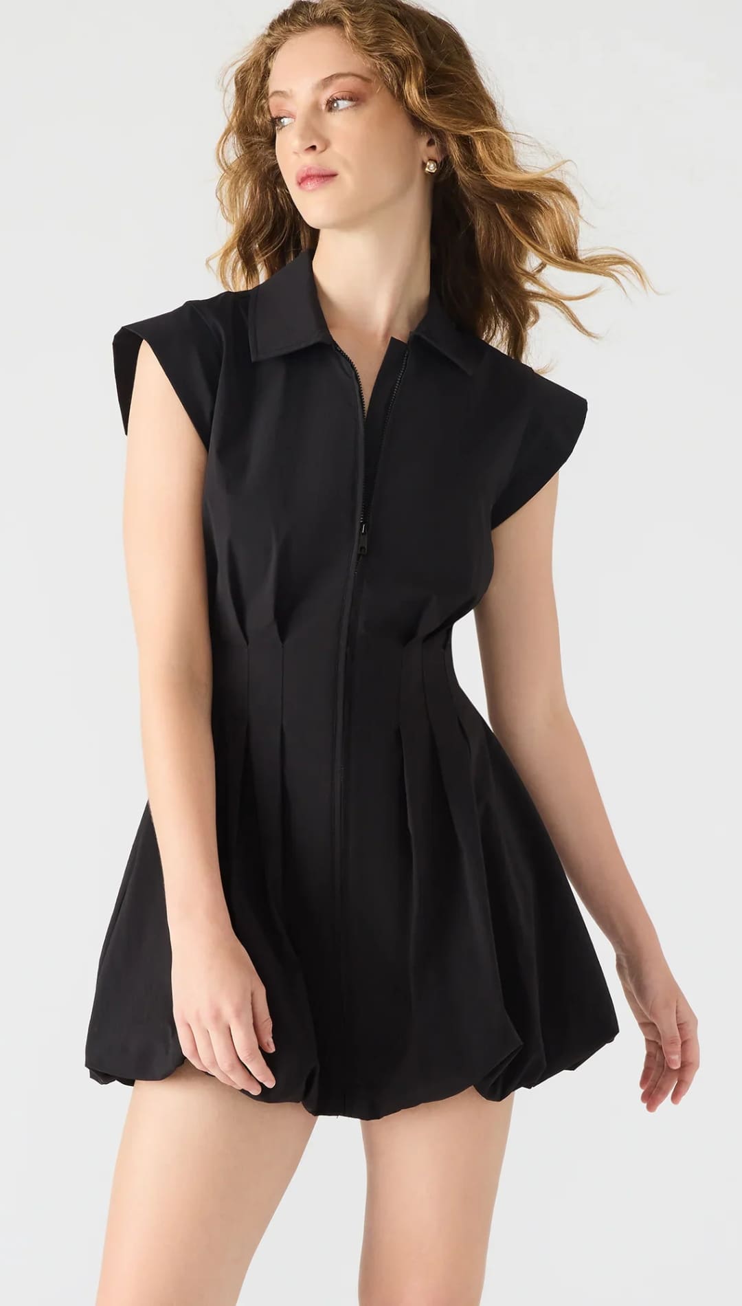 Black collared romper with pleated shorts.
