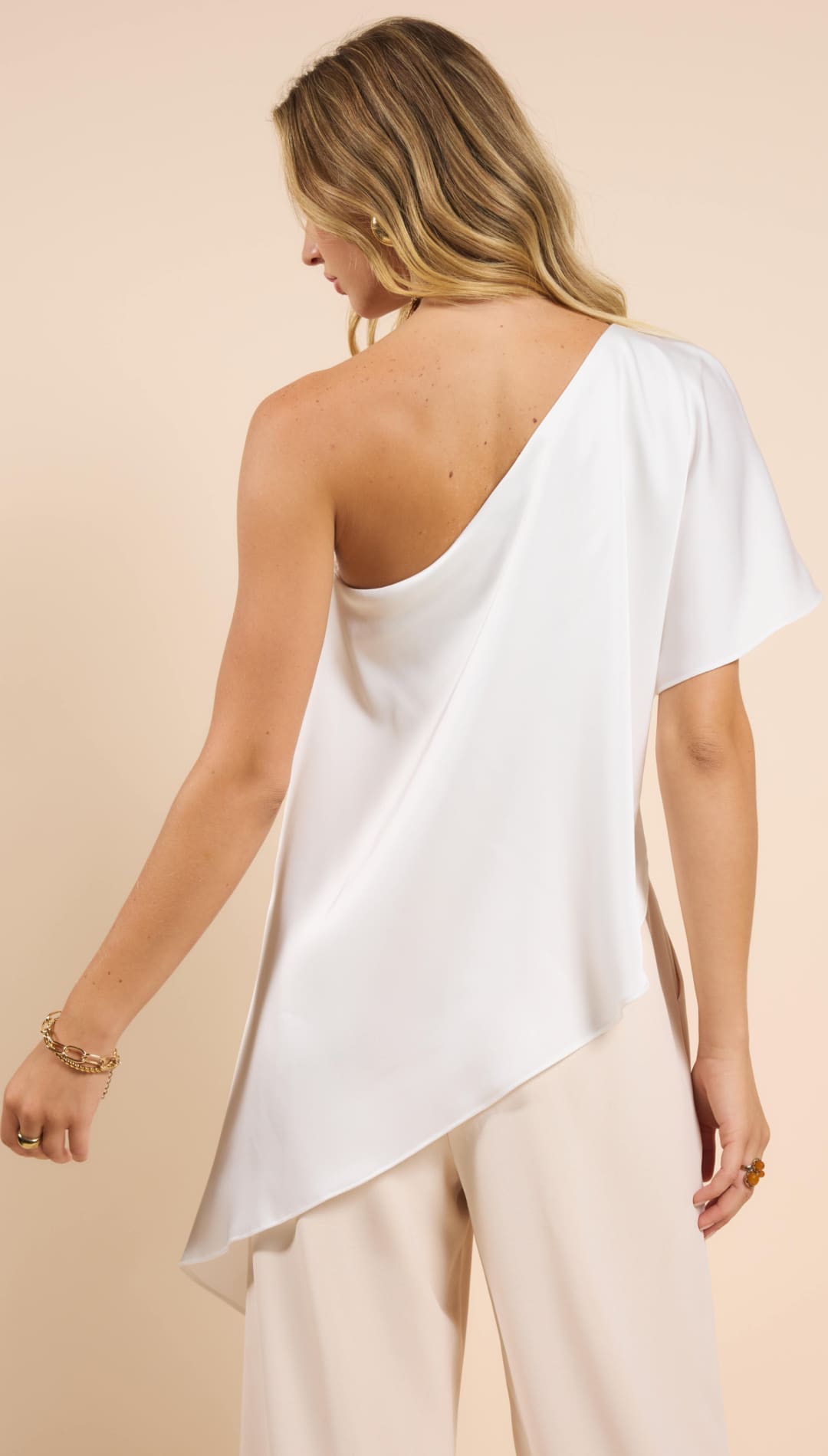 White one-shoulder top.