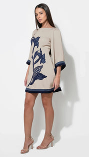Beige floral embroidered dress with navy accents and 3/4 sleeves.