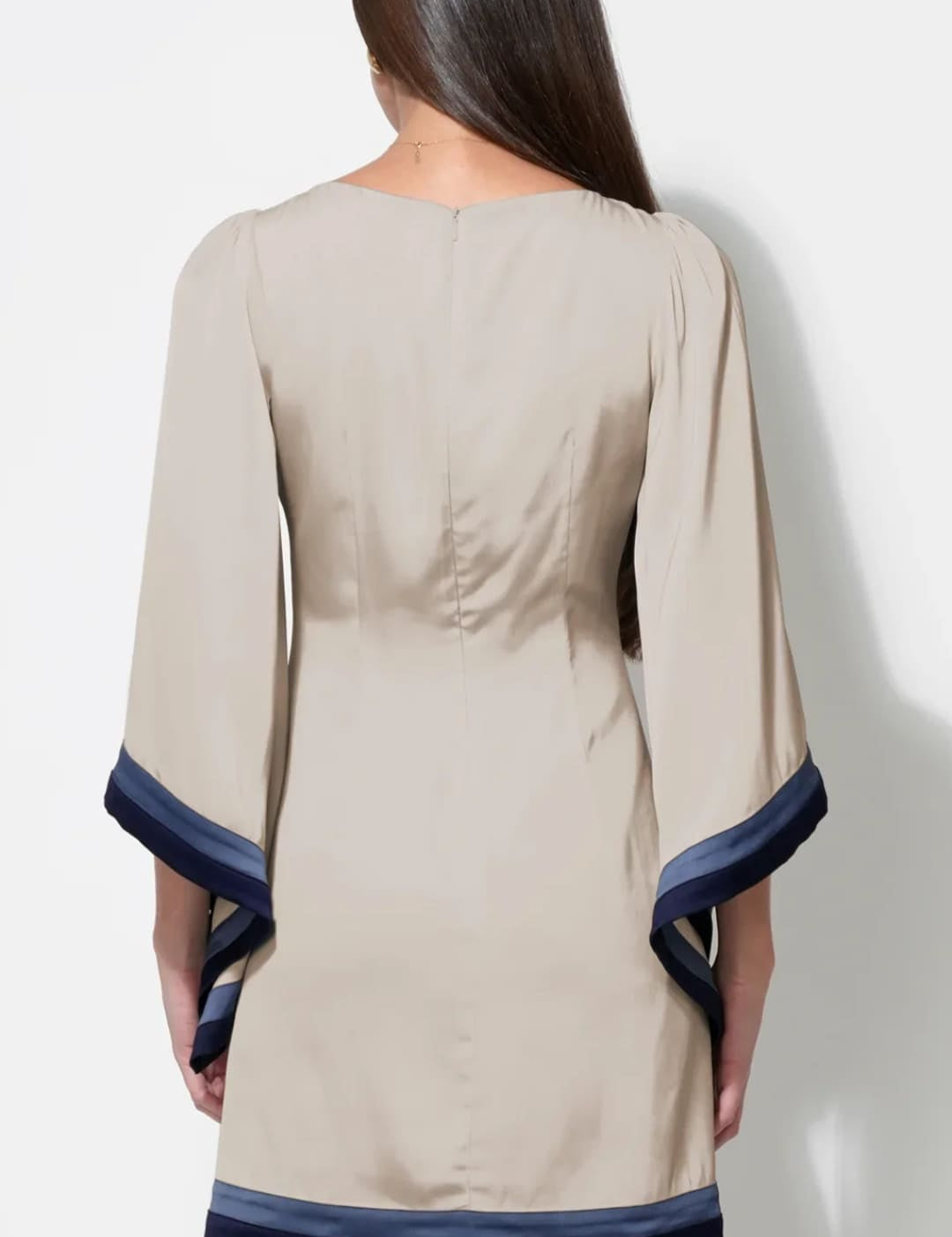 Beige and navy blue dress with bell sleeves.