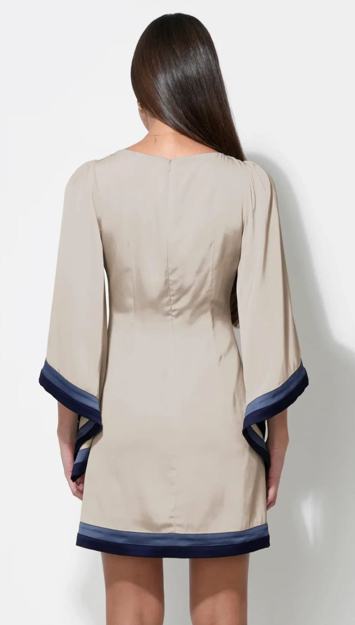 Beige and navy blue dress with bell sleeves.