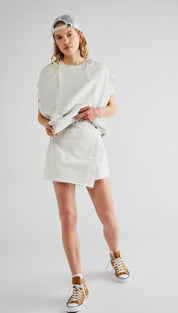 White oversized hoodie with a relaxed, draped silhouette and subtle frayed hem.