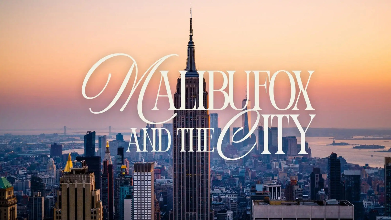 Empire state building skyline model with gold accents and intricate architectural details.