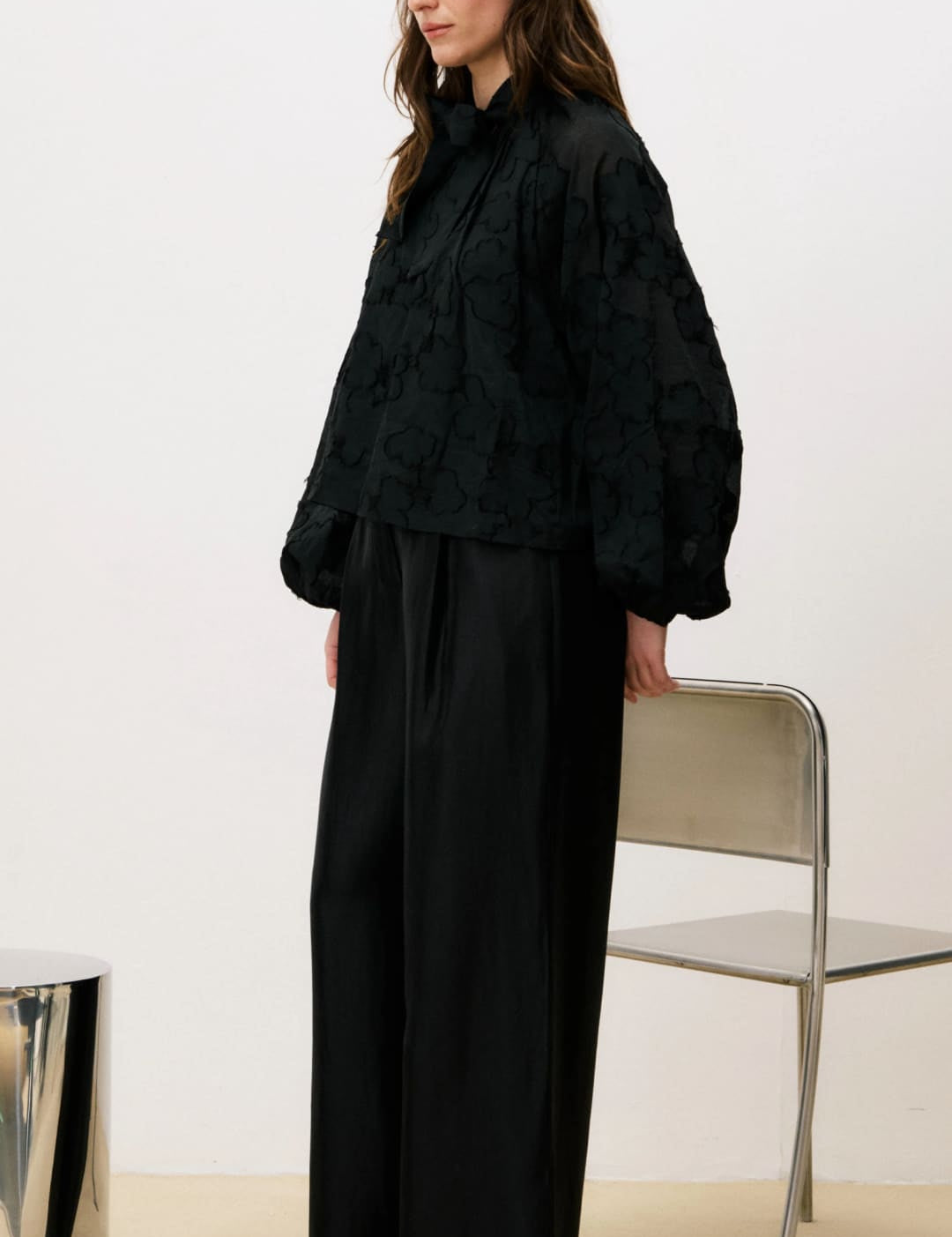 Black wide-leg pants with a relaxed fit and high waist.