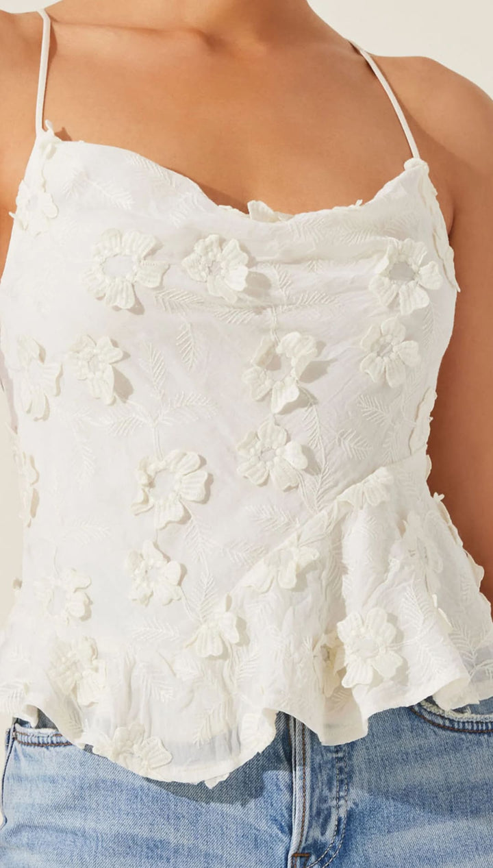 White floral-textured camisole top.