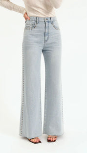 Light blue studded flare jeans.