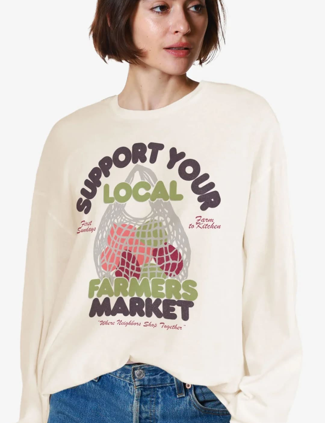 Cream-colored sweatshirt with ’Support Your Local Farmers Market’ graphic.