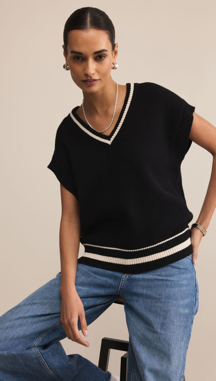 Black and white striped v-neck sweater with short sleeves, made of knit material.