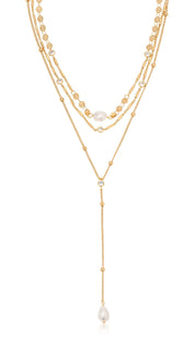 Gold-toned layered necklace with pearls.